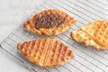 Plain Croissant Waffle or Croffle with chocolate sauce. Royalty Free Stock Photo