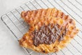 Plain Croissant Waffle or Croffle with chocolate sauce. Royalty Free Stock Photo