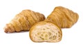 Plain Croissants and cut in half, showing the cross section, a classic crescent-shaped croissant. isolated on a white background.