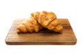 Plain croissants on cutting wood board on white background