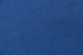 Plain dark blue fabric made of artificial materials as a wallpaper close-up Royalty Free Stock Photo