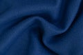 Plain dark blue fabric made of artificial materials as a wallpaper close-up Royalty Free Stock Photo