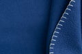 Plain dark blue fabric made of artificial materials as a wallpaper close-up Royalty Free Stock Photo