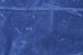 Plain dark blue fabric made of artificial materials as a wallpaper close-up Royalty Free Stock Photo