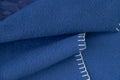 Plain dark blue fabric made of artificial materials as a wallpaper close-up Royalty Free Stock Photo