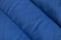 Plain dark blue fabric made of artificial materials as wallpaper close-up Royalty Free Stock Photo