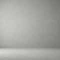 A plain, empty room features a textured gray wall and matching floor, creating a minim Royalty Free Stock Photo