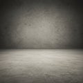 A plain, empty room featuring a textured concrete floor and wall. The lighting creates Royalty Free Stock Photo