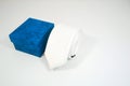 Plain fabric white tie rolled with gift box with white background close-up view Royalty Free Stock Photo
