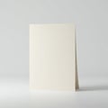 A plain, folded ivory cardstock standing upright against a subtle gray background. The Royalty Free Stock Photo