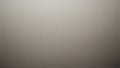 A plain gray textured background with a subtle gradient effect that transitions from light to dark creating a simple and neutral Royalty Free Stock Photo