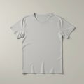 Plain light gray T-shirt displayed on a flat surface. Royalty Free Stock Photo