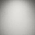 A plain light gray textured surface with subtle speckled patterns throughout Royalty Free Stock Photo