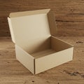 A plain, open cardboard box on a wooden surface. The box is medium-sized with flaps Royalty Free Stock Photo
