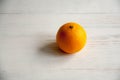 Plain orange mandarins on a grey background