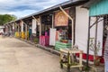 Plain outdoor dining for locals away from tourist places against a blue sky with clouds