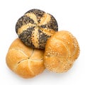 Plain, poppy seed amd sesame seed kaiser rolls isolated on white. Top view Royalty Free Stock Photo