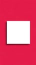 A plain red background with a centrally placed white rectangular card. The card casts Royalty Free Stock Photo