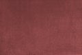 Plain red velours fleecy upholstery fabric texture background. Royalty Free Stock Photo