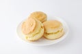 Plain scone biscuit isolated on a plate on white background