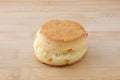 Plain scone biscuit on a plate on cutting board