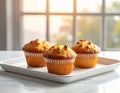 Three golden brown freshly baked corn muffins on a white rectangular tray Keywords: muffin, corn muffin, baked Royalty Free Stock Photo