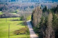 plain simple countryside spring landscape with fresh green meadows and forests Royalty Free Stock Photo