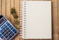 Plain Spiral Notebook With Pen Beside Calculator And Coins On Table. Simple Notepad And Ballpen Alongside Calculation