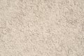 Texture of an empty beige stucco wall