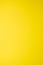 plain texture of a yellow gradient, vertical image, empty background