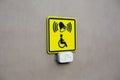 Plain wall with disabled sign and call button. News about creating accessible environment for people with disabilities. Concept Royalty Free Stock Photo