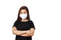 Plain white background with space for text. Asian lady wearing face mask for protection against coronavirus. Half body view young