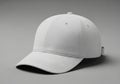 A plain white baseball cap is displayed against a neutral gray Royalty Free Stock Photo