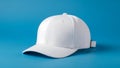 Plain White Baseball Cap on a Solid Blue Background image photo Royalty Free Stock Photo
