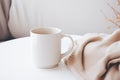 Plain white blank mug cup, beige neutral rustric cottagecore, on beige linen, product display Royalty Free Stock Photo