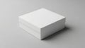A plain white box is positioned on a subtle gray background, casting a soft shadow Royalty Free Stock Photo