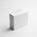 Plain white cardboard box with a hanging tab, casting a shadow on a light gray background Royalty Free Stock Photo