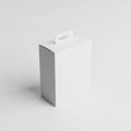White Cardboard Box with Hanging Tab on a Light Gray Background packaging blank Royalty Free Stock Photo