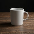 A plain white ceramic mug with a curved handle is centered on a textured wooden Royalty Free Stock Photo