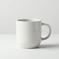 A plain white ceramic mug with a cylindrical shape and a rounded handle, set against a Royalty Free Stock Photo