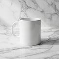 A plain white ceramic mug with a handle sits on a marble surface. The surface and Royalty Free Stock Photo