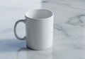 A plain white ceramic mug is placed on a light gray marble Royalty Free Stock Photo
