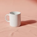 Plain white ceramic mug is placed on a light pink surface, casting a shadow Royalty Free Stock Photo