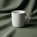 The fabric appears softly draped, creating gentle waves around the mug Royalty Free Stock Photo