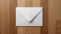 Plain White Envelope on Wooden Surface Top View Royalty Free Stock Photo