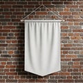 A plain white fabric banner hangs from a wall, mounted on a wooden dowel. The Royalty Free Stock Photo