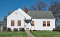 Plain White House with Halloween Spider Webs on Shrubs Royalty Free Stock Photo