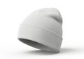 A plain white knitted beanie hat is displayed as an isolated object on a white background isolated on white background Royalty Free Stock Photo