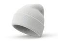 A plain white knitted beanie hat with a ribbed cuff isolated on white background Royalty Free Stock Photo