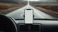 A plain white mock up smartphone screen in a phone holder on a car dashboard Royalty Free Stock Photo